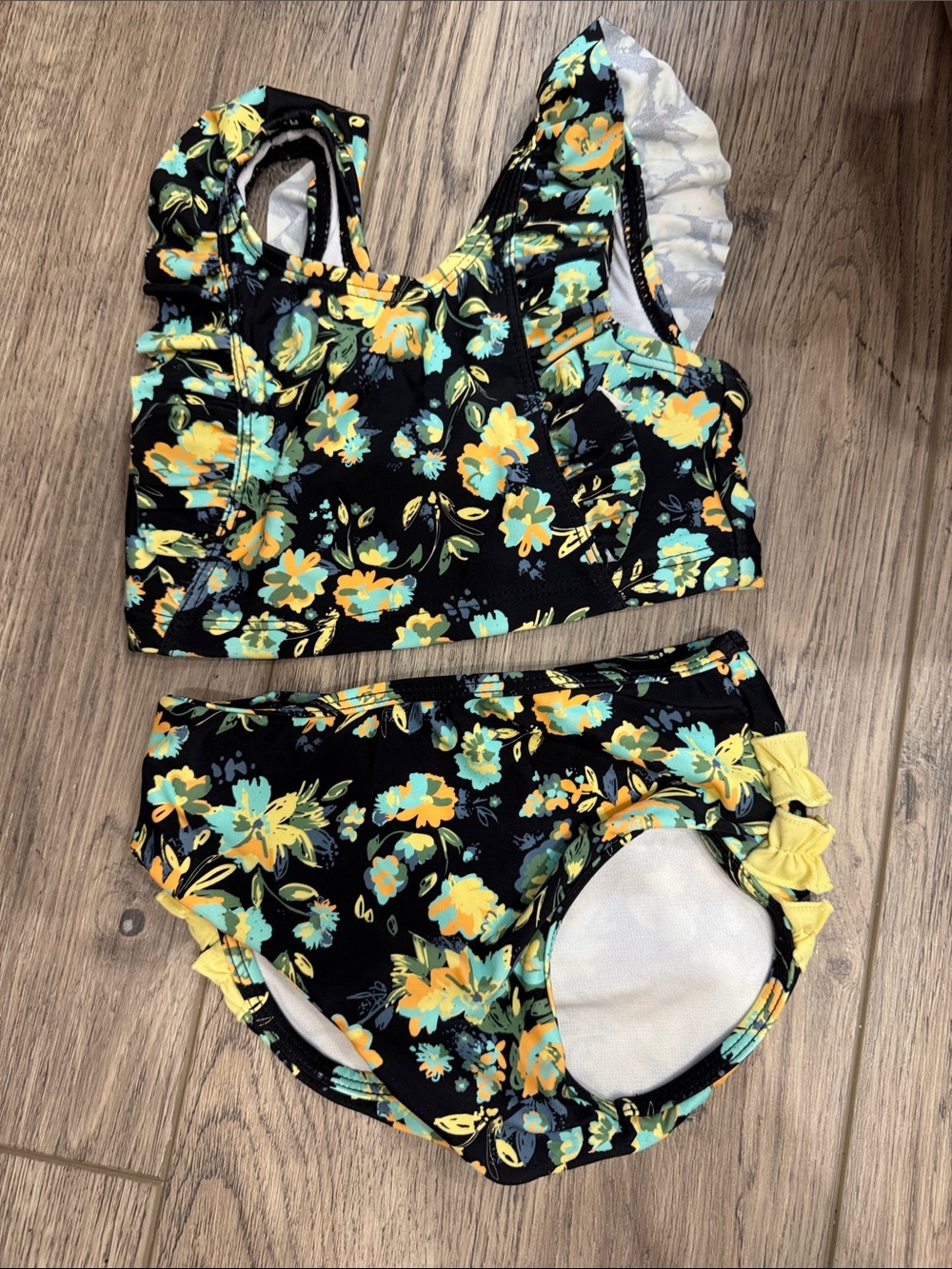 Ruffle Butts Black Floral Two-Piece Girls Swim Set in Yellow & Teal